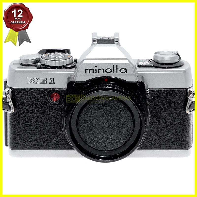 “Minolta XG-1 silver fotocamera reflex automatica con otturatore elettronico. XG1